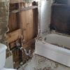 Demolition of old bathroom walls, tile and tub.