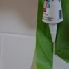Use painters tape on shower trim and wall prior to caulk for a clean results.