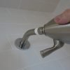 Install shower to hand tight, then tighten 1 - 2 turns with a protected wrench.