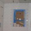 Almost finished setting tiles on shower walls and ceiling.