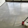 Latex bonding primer applied prior to pouring self-leveling underlayment to improve substrate bonding.