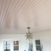 White painted porch beadboard ceiling.