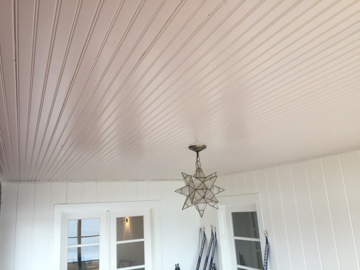 White painted porch beadboard ceiling.