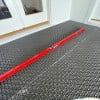 Check level of the radiant heat membrane using a 6' level.