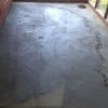 Using fortified (latex modified) mortar mix to fill in and feather edges. Concrete allowed to cure and dry for 30 days.