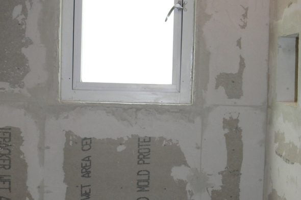 DIY shower niche built using backer board and paint-on waterproofing.