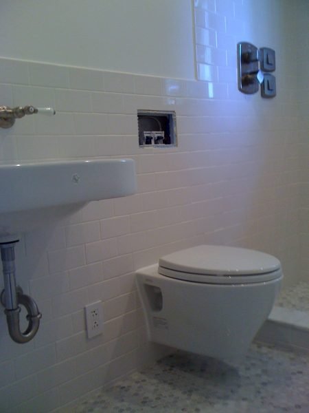 Finished bathroom wall were I used tile backer board which was finished with paint and tile.