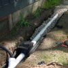 French drain pipe assembled showing wye fitting with sump pump discharge