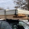 Image of a car load of foil-faced rigid foam insulation and 1 x 12 cedar boards for a wine cellar installation.