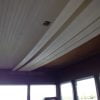 Beadboard ceiling install aided by temporary board holder make from 2 x 4s.