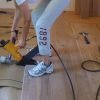 Installing flooring using Bostitch MIII flooring stapler.
