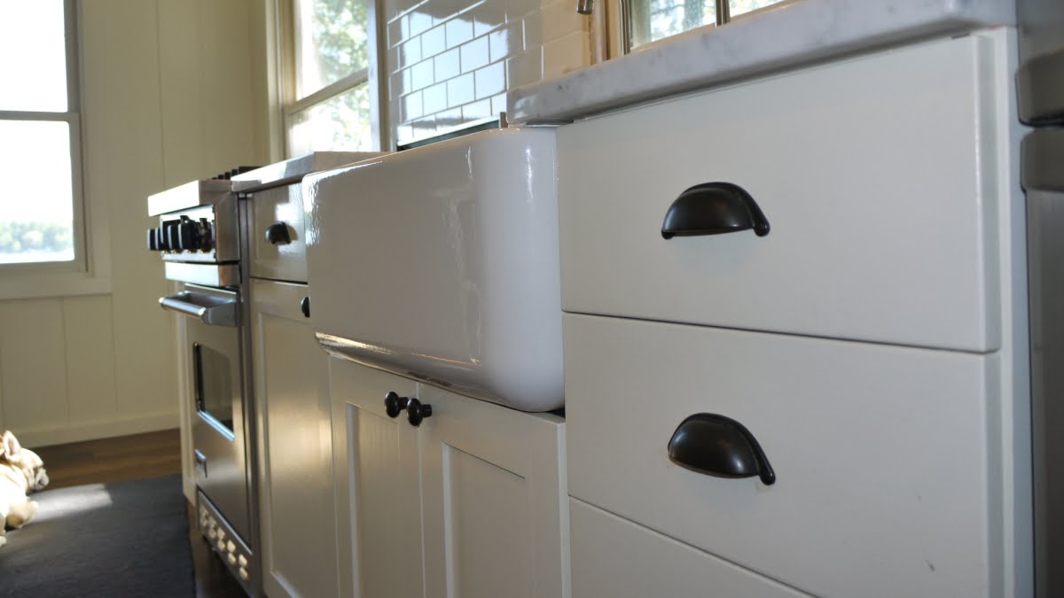 Paint kitchen cabin cabinets - Ikea Tidaholm dark oak cabinets painted white.