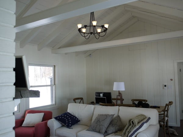 Painted interior wood paneling, ceiling and beams - after.