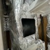 An image of a finished cutout in the supply ductwork of our furnace, ready to mount the UV air purifier unit.