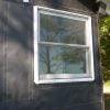 Tuck weather-resistant barrier under side and bottom nailing fins of existing windows if possible.