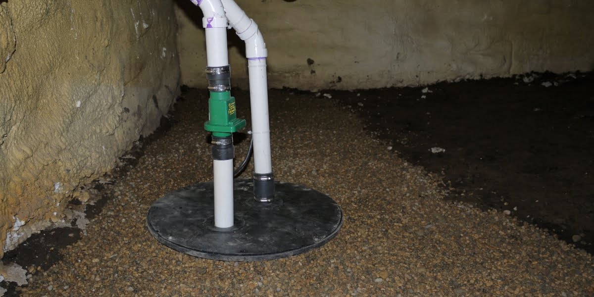 Sump pump and sump basin install in a crawl space.