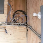 Tankless water heater wiring connections and conduit.