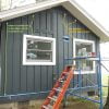 Install trim and then battens for board and batten siding install.