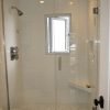 Finished walking in shower with heavy glass door and white subway tiles - how to do it yourself.