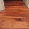 Closeup of wide-plank american walnut wood flooring.