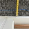 Install the electric radiant heating cable spacing it at least 3" from any walls or cabinets.