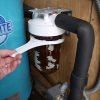 Replacing whole house water filter element - use supplied filter housing wrench to open filter housing.