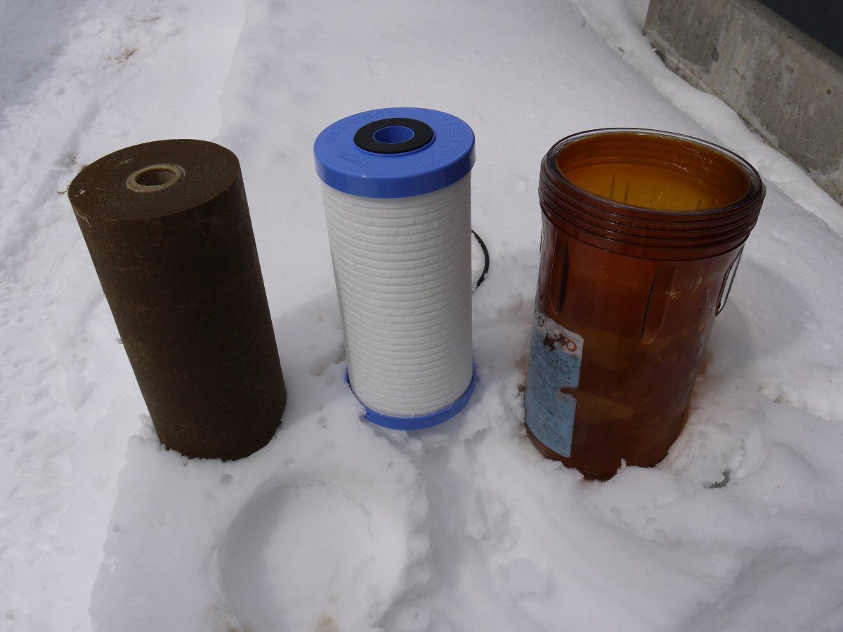 Whole house water filter elements - new and after six months of use.