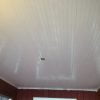 White painted porch beadboard ceiling.